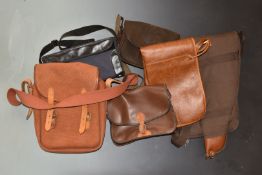 Four shotgun cartridge bags including Barbour and The Mamba Collection, together with two gun slips.
