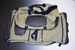 Land Rover suit bag with additional compartments and a similar holdall