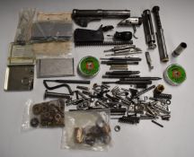 A collection of Acvoke air pistol parts including barrels, trigger mechanism, springs etc, likely