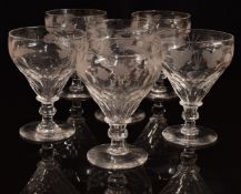 A set of six clear cut glass ale glasses with engraved decoration of barley and hops, raised on