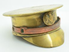 WW2 trench art officer's cap made from a brass shell, with copper chin strap and button badge,