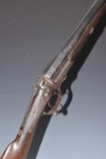 John Ilsley 12 bore single barrelled hammer action shotgun with engraving of dogs to the lock,
