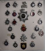 Twenty-four police badges including Gloucestershire, Swansea, Parks Constabulary, Norfolk, South