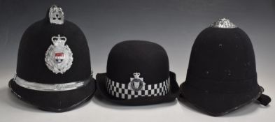 West Mercia Constabulary policeman's helmet, together with an unbadged example, both with liners and