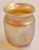 Louis Comfort Tiffany favrile glass vase in iridescent gold with dimpled sides, marked LCT to