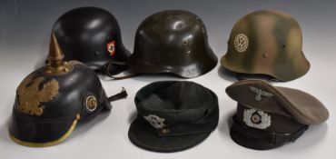 Five German WW2 replica helmets / caps including Army M42 field cap, SS steel helmet, together