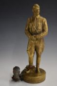 Brass figure of Adolf Hitler in uniform, with a symbolic decapitated head of himself attached to his