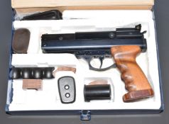BSA .22 target air pistol with shaped wooden grips and adjustable trigger and sights, serial