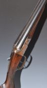 BSA 12 bore side by side shotgun with border engraved locks, hammers, underside, fences and thumb