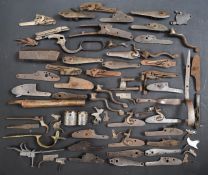 A collection of shotgun, pistol and revolver parts including cylinders, trigger guards, Winchester