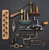 A collection of 16 bore shotgun re-loading and shooting accessories comprising two capper and