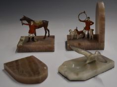 Pair of hunting interest bookends with alabaster bases and cold painted metal huntsmen with horse
