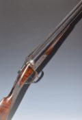 E J Churchill 12 bore side by side ejector shotgun with scrolling engraving to the named locks,