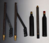 Three PCP air rifle filling bottles together with two air rifle pumps.