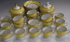Approximately 28 pieces of 19thC English porcelain tea ware, with gilt decoration on a yellow
