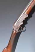 English .410 folding poacher's shotgun with chequered grip and forend and 28 inch barrel, overall