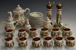Capodimonte twelve place setting tea set with relief moulded figural decoration and two salt and
