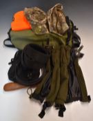 A collection of sporting or shooting equipment including game or fishing bag, gaiters, camouflage
