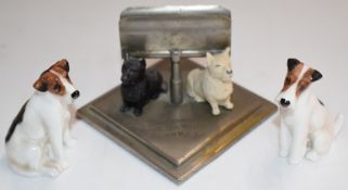 Two Royal Doulton K Series dog figures and a Buchanan's 'Black and White' Scotch Whiskey figural dog