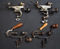 Four 12 bore shotgun cartridge rollover tools including one stamped 'AG'.