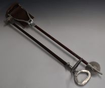 Two vintage shooting sticks, one with leather seat engraved 'FC Gill'.