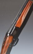 Baikal 12 bore over and under ejector shotgun with engraved lock, trigger guard and underside,