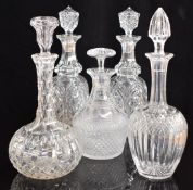 Five cut glass decanters including a pair of Georgian examples, largest 32cm tall.