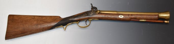 Percussion hammer action blunderbuss with engraved lock, hammer and brass butt plate, chequered