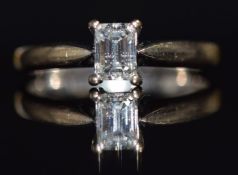 An 18ct white gold ring set with an emerald cut diamond of approximately 0.5ct, size M, 3g