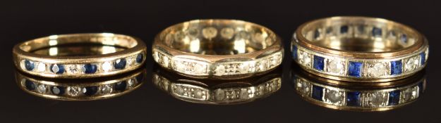 A 9ct gold half eternity ring set with sapphires and diamonds and two other 9ct gold eternity rings