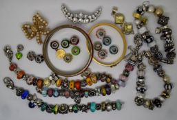 A collection of silver beaded bracelets including Pandora style, silver cross pendant, Halcyon