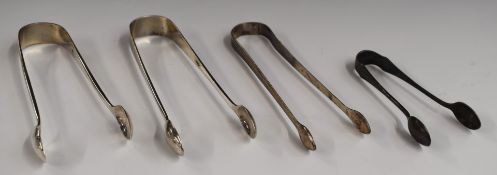 Four pairs of Georgian and later hallmarked silver sugar tongs, length of longest 14.5cm, weight