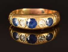 An 18ct gold ring set with sapphires and diamonds, Chester 1914, size J, 2g