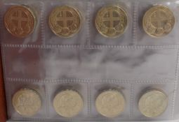 Coin album containing a collection of UK round £1 and Olympic 50p coins