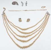 A 9ct gold necklace made up of rectangular links (1.7g), silver brooch set with paste, faux