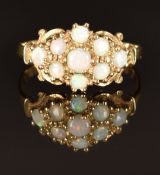 A 9ct gold ring set with opals in a cluster, size P, 2g