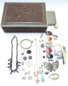 A collection of jewellery including silver pendants, agate plaques, etc in a carved wooden box