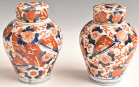 A pair of 19thC Oriental lidded jars of bulbous form, with Imari decoration, internal cover and lid,