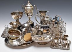 Silver plated ware including egg cruet with cow finial, Garrard wine coaster, baskets, tea set