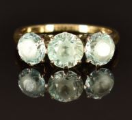 A 9ct gold ring set with three round cut zircon, size L, 3.7g