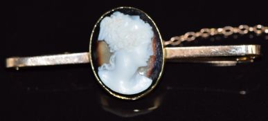 A 9ct gold brooch set with a carved agate cameo, 5cm long