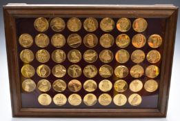 Cased set of gold plated bronze medallions 'The World's Greatest Sculptures' in glazed display case,