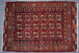 Turkoman fine wool rug on a wine ground, 158 x 109cm