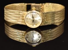 Omega De Ville 9ct gold ladies wristwatch with black hands, gold hour markers, silver dial and