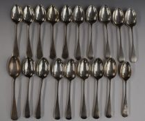 Nineteen 20th century Old English pattern hallmarked silver dessert spoons including three sets of