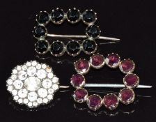 Three Victorian brooches, one set with paste, one with garnets and one with jet