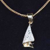 A 14k gold pendant (1g) set with diamonds on a 9ct gold chain, 1.6g