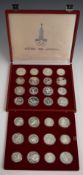 A cased set of 1980 Moscow Olympic silver coins comprising 28 crown sized or similar silver coins,