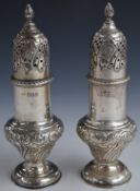 Victorian pair of hallmarked silver sugar casters with embossed decoration, London 1899, maker