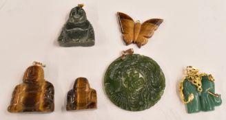 Three tiger's eye pendants, two nephrite jade pendants and an aventurine quartz pendant with a 14k
